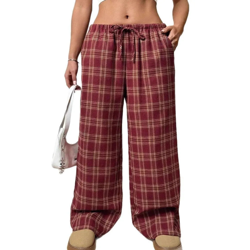 Women's loose fit plaid trousers with a drawstring waist and side pockets, shown in blue.