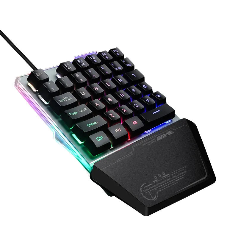 Black G40 Flow one-handed mechanical keyboard with RGB backlit keys on a desk