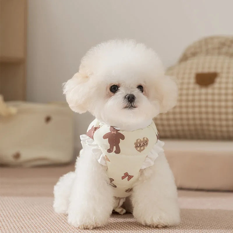 Cream fleece pet jumpsuit with bear print and white ruffles, four-legged design on small dog