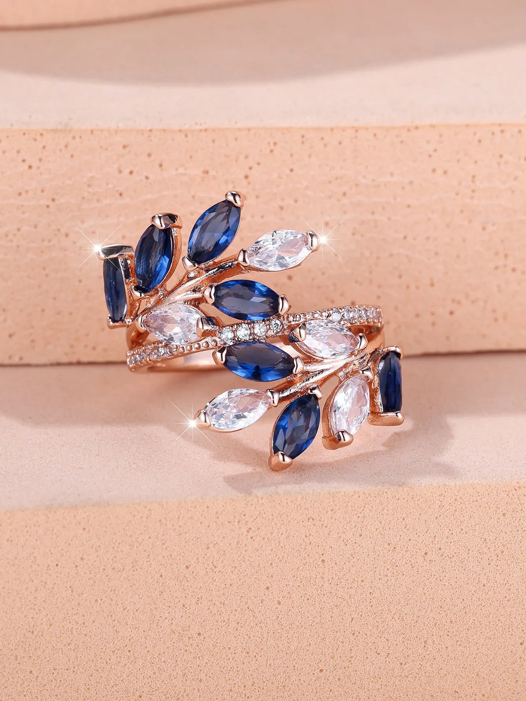 Adjustable copper leaf fashion ring with a central horse eye zircon stone, shown in a rose gold finish.