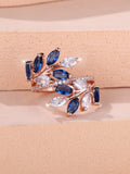 Adjustable copper leaf fashion ring with a central horse eye zircon stone, shown in a rose gold finish.