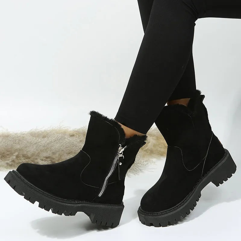 Women's black thick plush snow boots with side zipper and faux suede upper on a non-slip rubber sole.