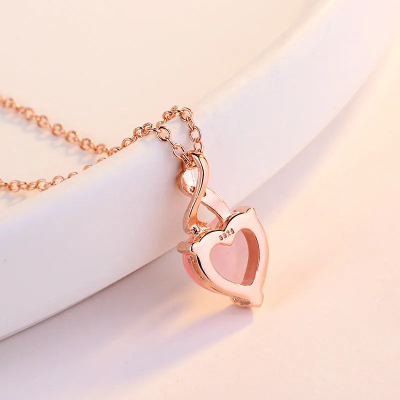 Women's heart-shaped pink artificial crystal pendant necklace on rose gold cross chain