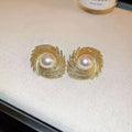 Women's vintage pearl earrings with flower-shaped alloy design and irregular hand-finished elements