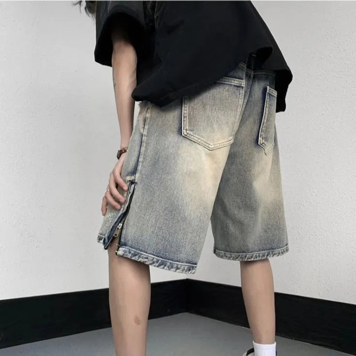 Blue retro style wide leg denim shorts with tattered detailing and loose fit