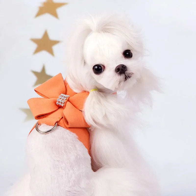 Cute pink bowknot chest strap for a small dog on a white background.