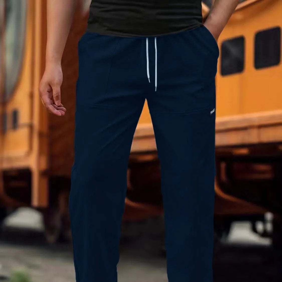 Men's light grey polyester casual trousers for spring and autumn wear.