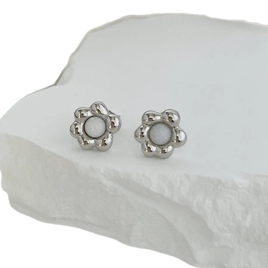 S925 sterling silver black agate flower ear studs in gold colour close up