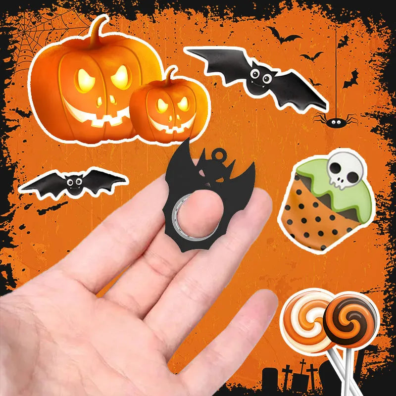 Black plastic Halloween bat demon ghost fidget spinner keychain with bottle opener on a dark background