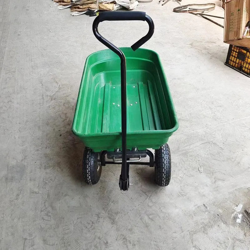 Green four-wheel plastic dump truck with a tipping bed, model TC2145.