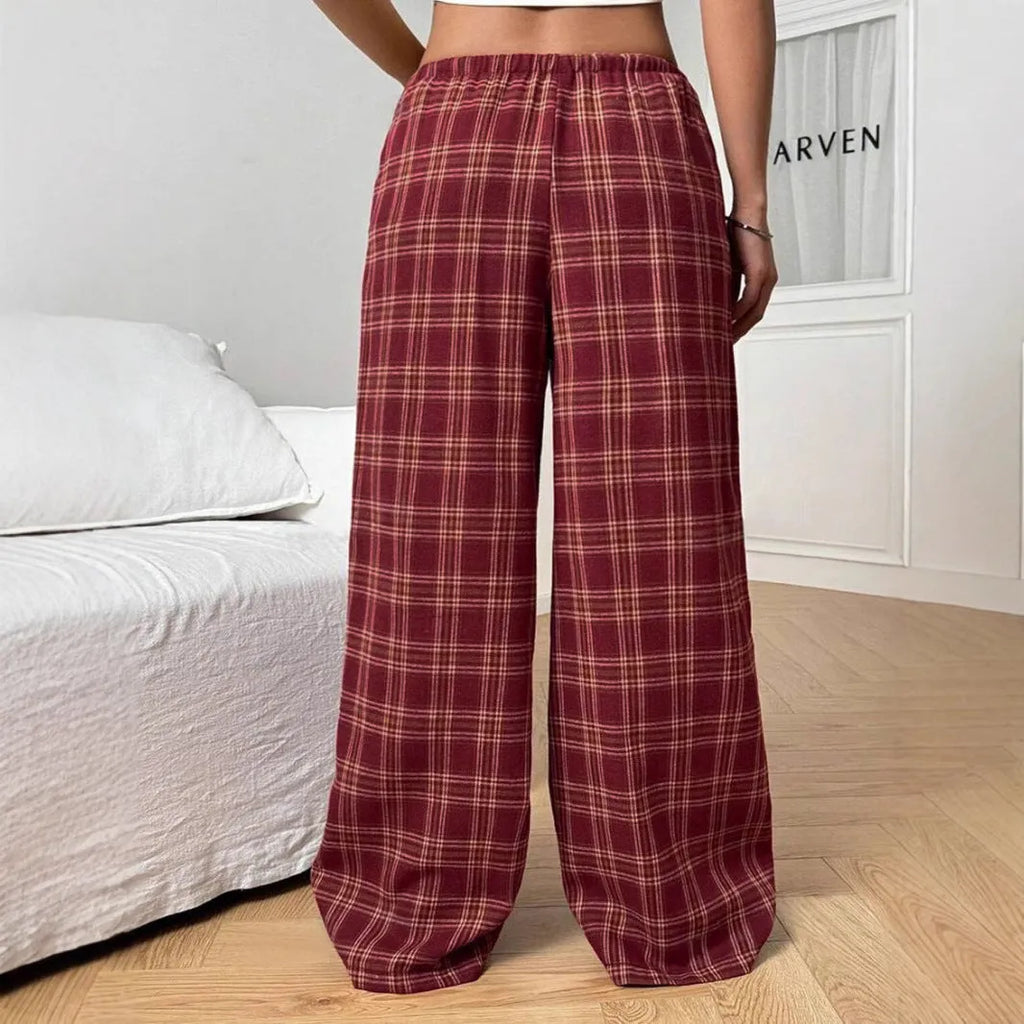 Women's loose fit plaid trousers with a drawstring waist and side pockets, shown in blue.