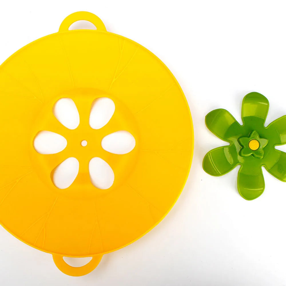 Silicone spill-proof pot cover in black, size 30x26cm, resting on a pot