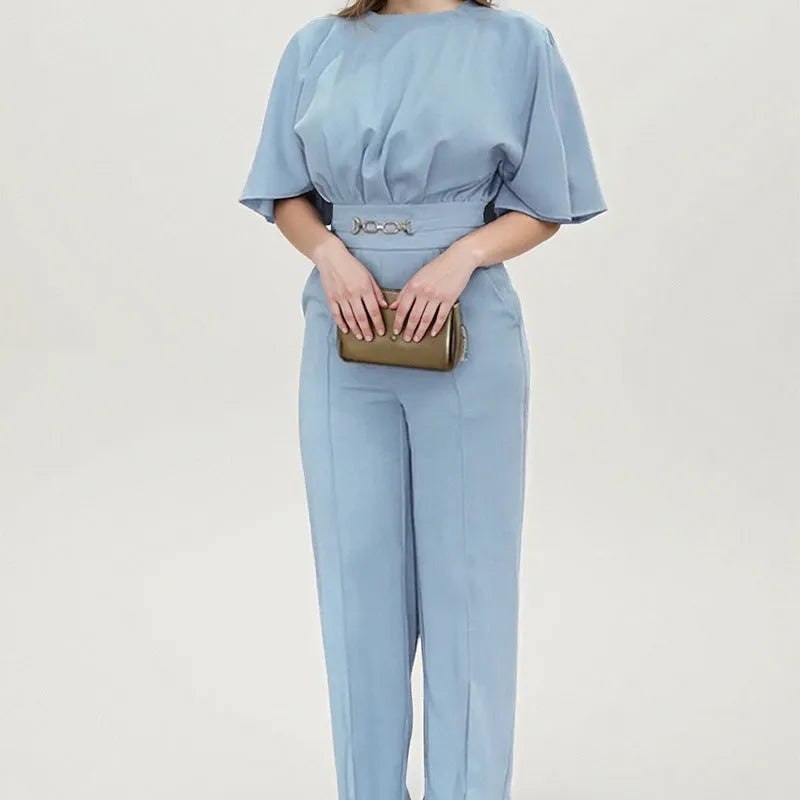 Blue men's casual polyester suit with long sleeve jacket and trousers on a hanger