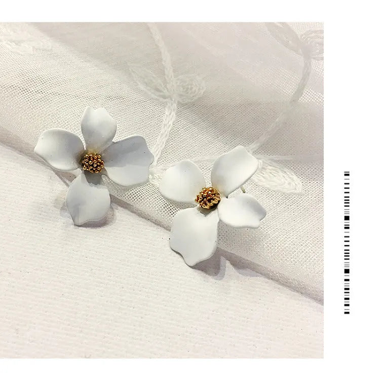A pair of small floral-shaped stud earrings in alloy, shown in pink and white colour options.