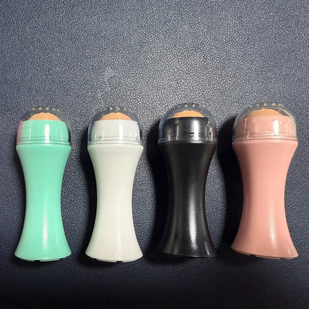 Volcanic stone oil control roller in black, green, pink or white for reusable facial skincare.