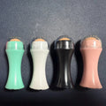 Volcanic stone oil control roller in black, green, pink or white for reusable facial skincare.