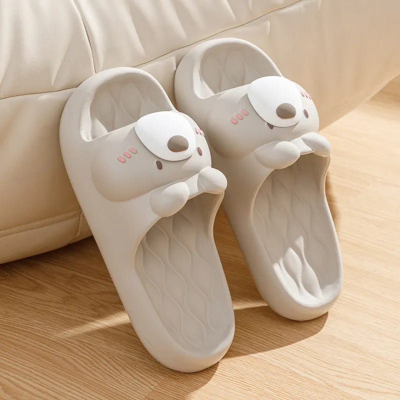 Pair of brown cartoon bear EVA flip flops for adults, toe baring sandal style