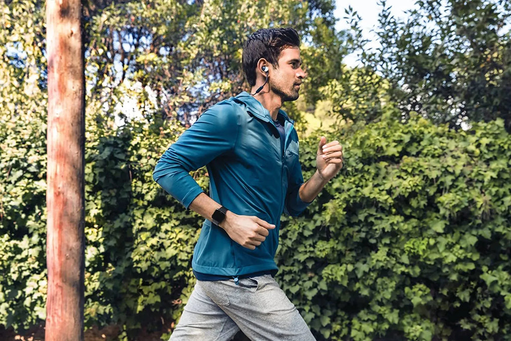 Black smart watch with heart rate monitoring and sleep tracking on a wrist, showing the 1.4-inch screen display