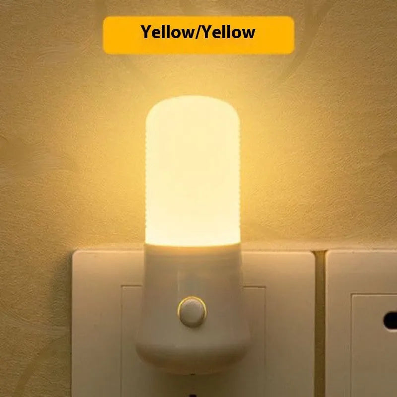 White minimalist plug-in bedside night light with dual colour switch showing 6.5cm cube dimensions