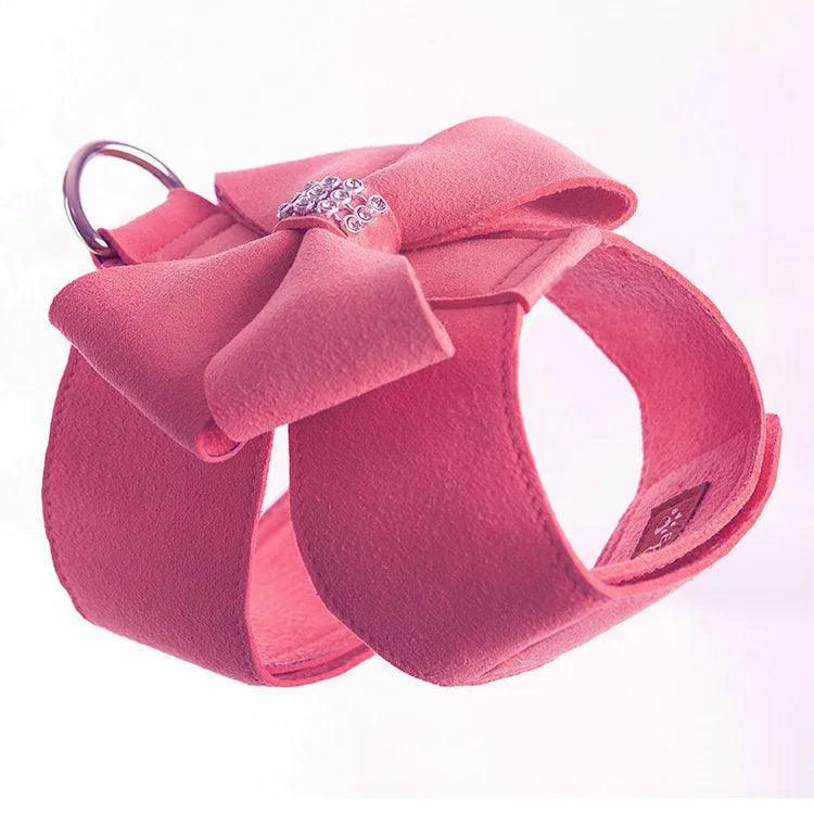 Cute pink bowknot chest strap for a small dog on a white background.