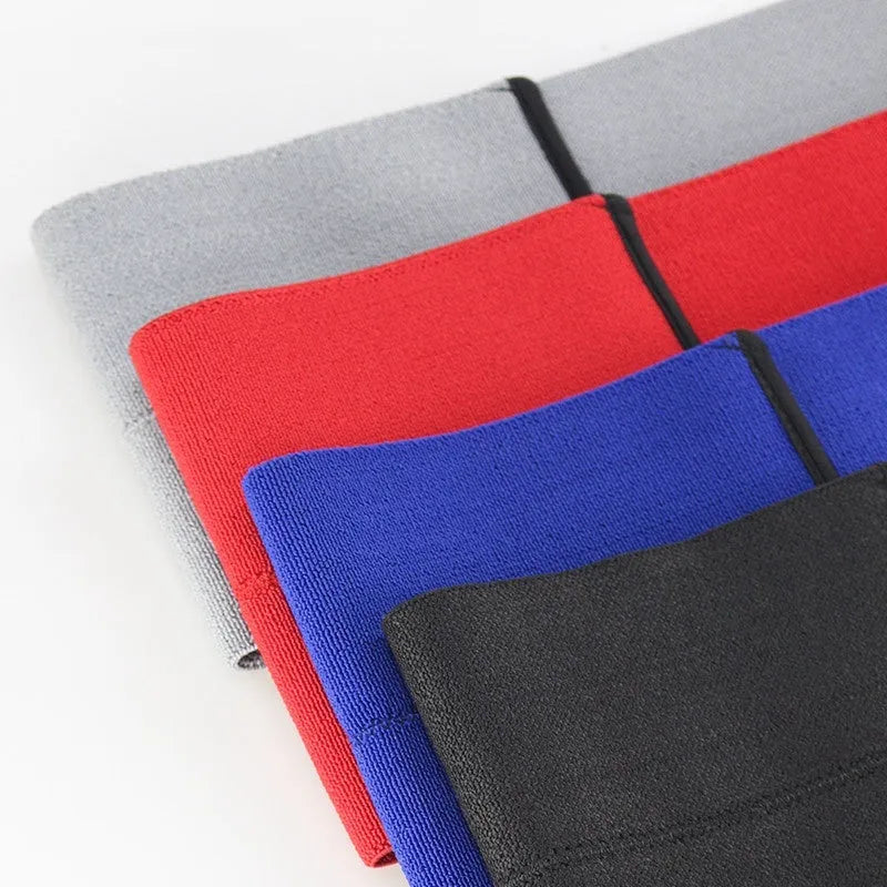 A black elastic bandage wrapped around an elbow, showing its adjustable fit for sports protection.