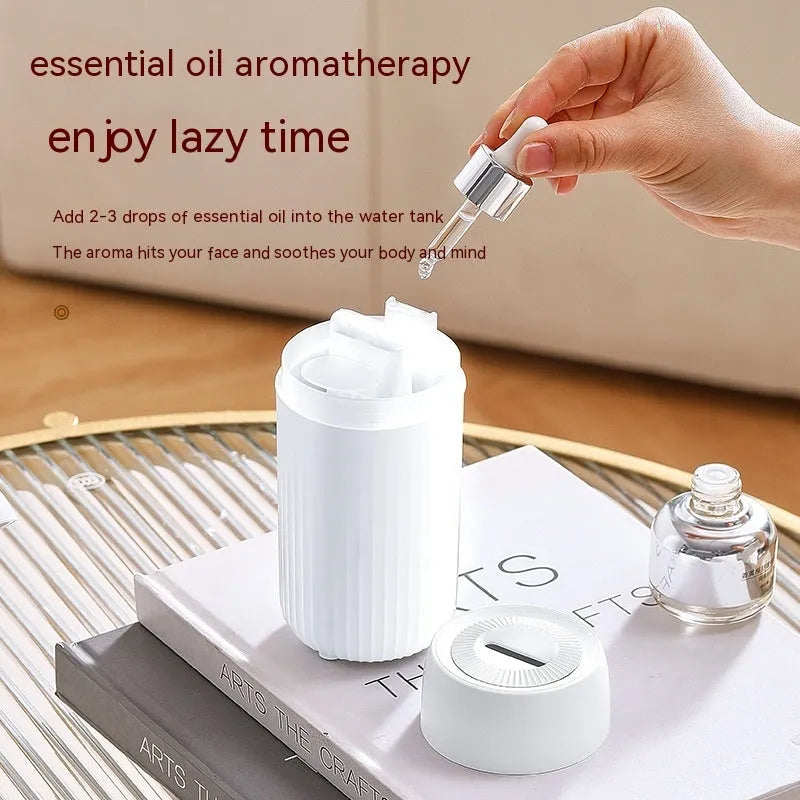 Car aroma diffuser with flame simulation effect showing black and white colour options