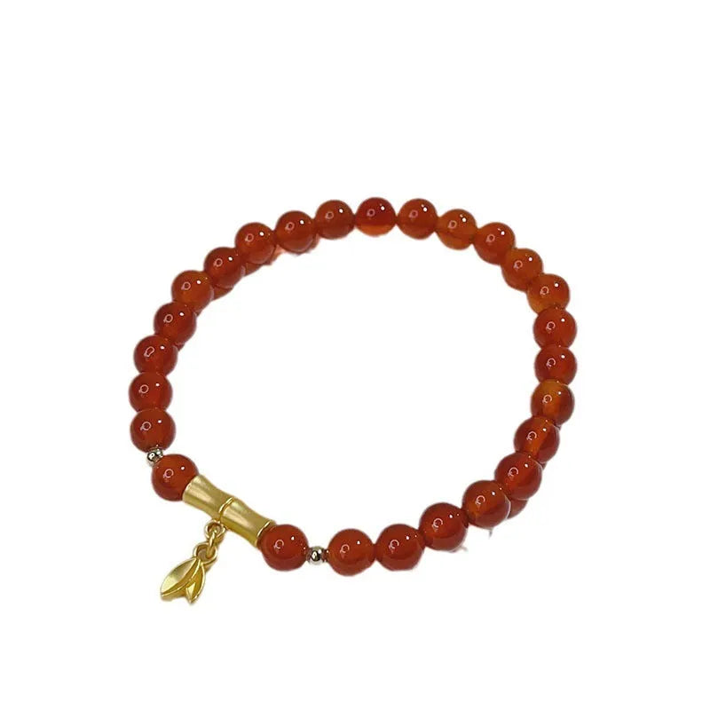 Handcrafted red agate bracelet for women with Chinese dragon design and lucky charm variations
