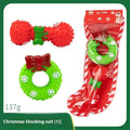 Seven Christmas vinyl dog toy gift sets with bite-resistant designs including Santa heads and holiday shapes