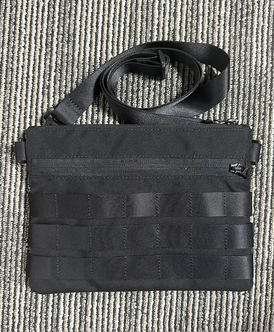 Black Oxford cloth military style outdoor carry bag measuring 18 by 3.5 centimetres