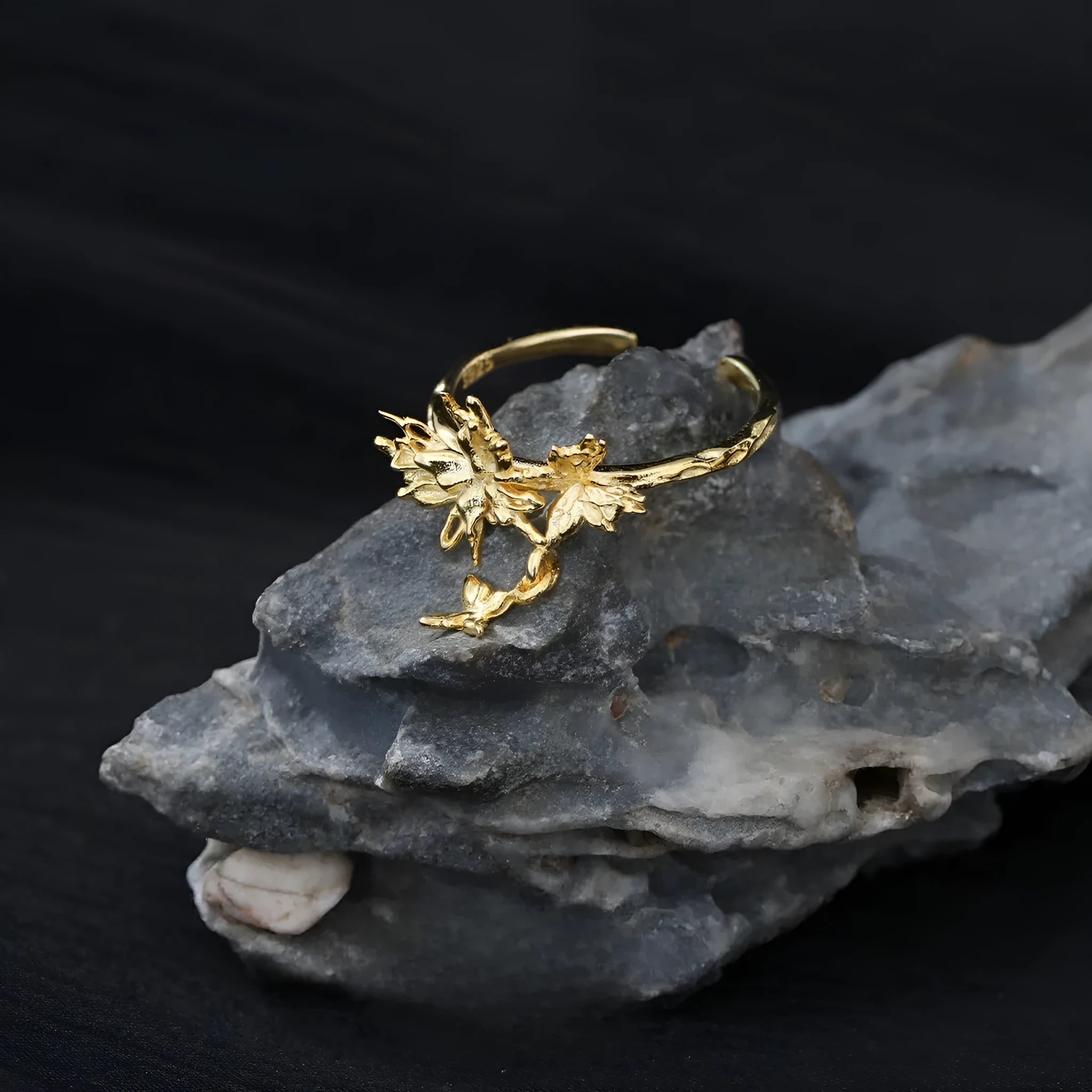 Silver butterfly ring with adjustable opening and electroplated gold finish options.