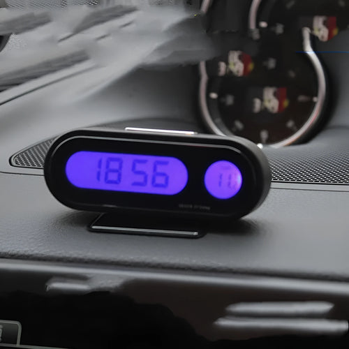 Black car digital clock thermometer with luminous display on adjustable bracket showing time and temperature