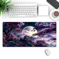 Large black gaming mouse pad with precision lock edge on desk with keyboard