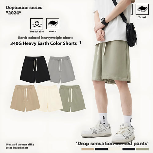 Loose-fit cotton denim shorts for baby or toddler in charcoal grey colour on a hanger.
