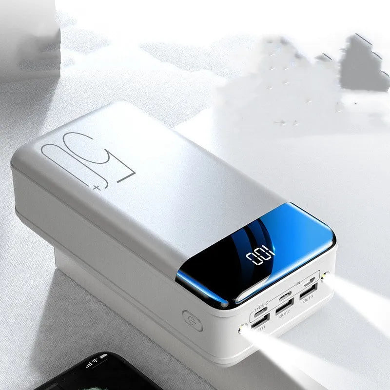 Black and white large 50000mAh portable power bank with three USB ports on the side