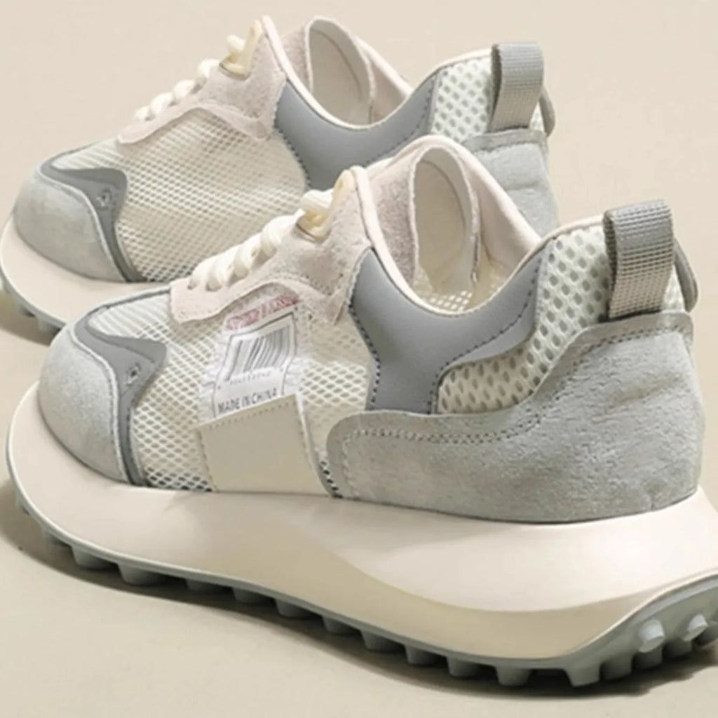 Women's grey and pink retro sneaker with low-top design and flat rubber sole