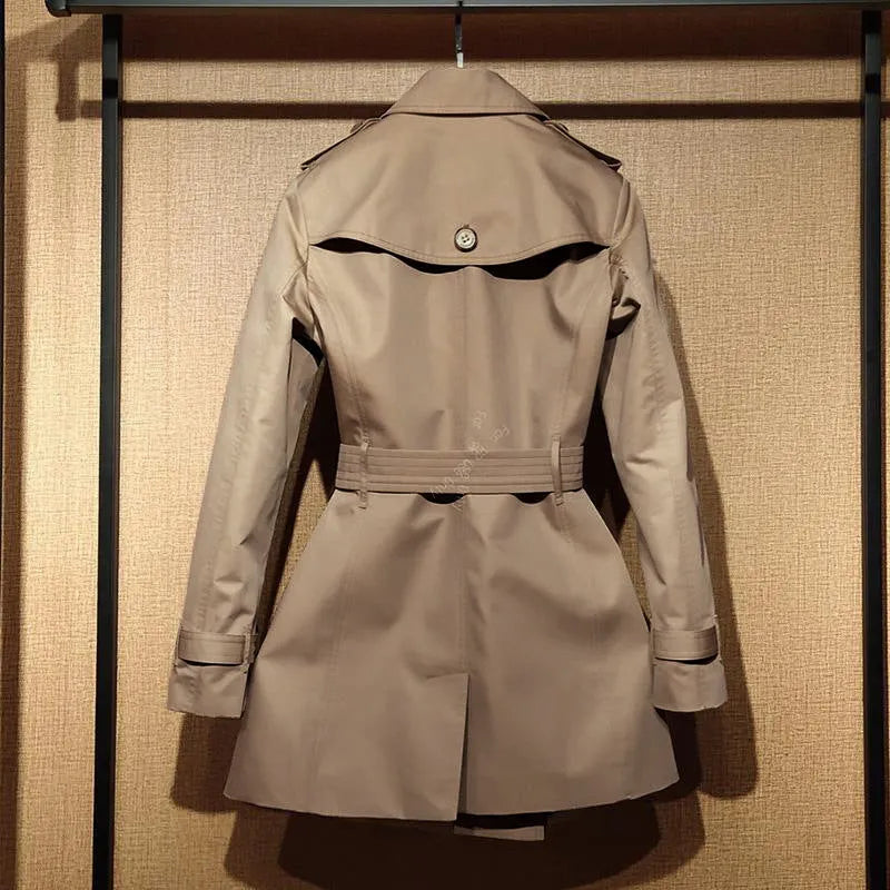 Khaki double-breasted trench coat for women with long flight sleeves, shown on a hanger.