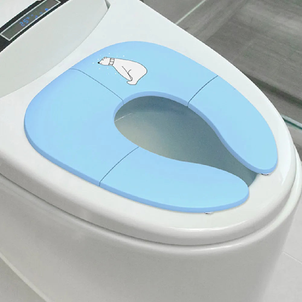 Foldable baby travel potty seat in blue with splash guard, shown folded and open on a white background