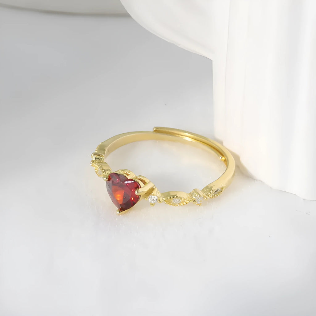 Red zirconium heart-shaped ring in yellow gold electroplated silver with adjustable open band