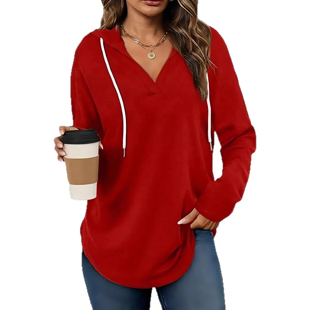 Women's loose fit black hooded V-neck sweatshirt with long sleeves on a hanger.