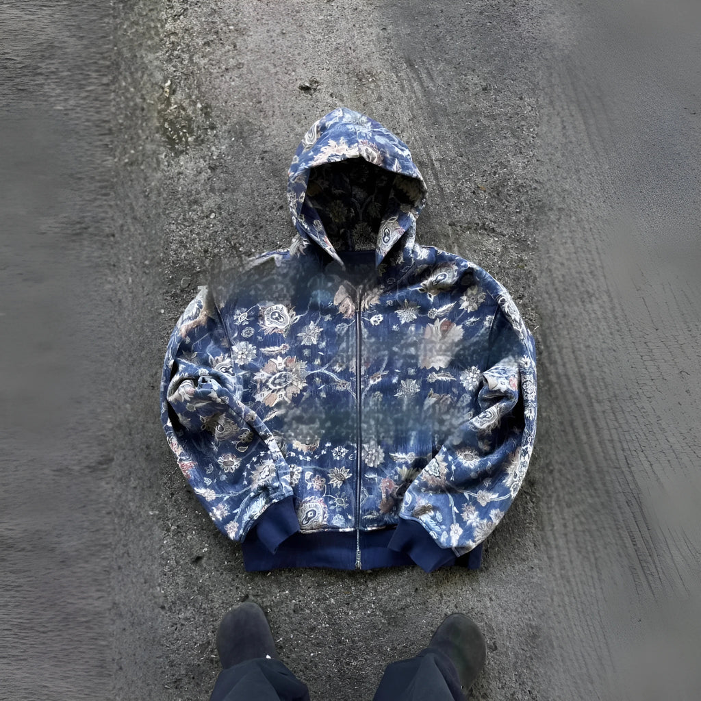 Man wearing a blue loose-fit zip hooded coat with the hood up, showcasing casual autumn style.