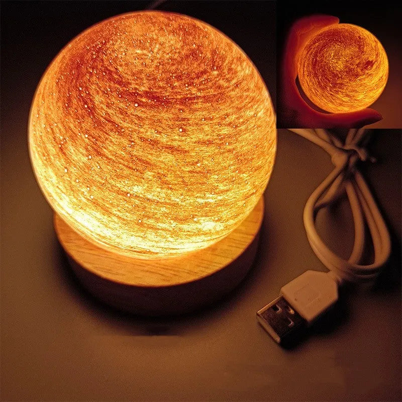 Modern planet-shaped USB night light on its base with dimmable multi-colour glow
