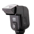 Compact silver SLR camera flash with a 90-degree adjustable bounce head on a hot shoe mount.