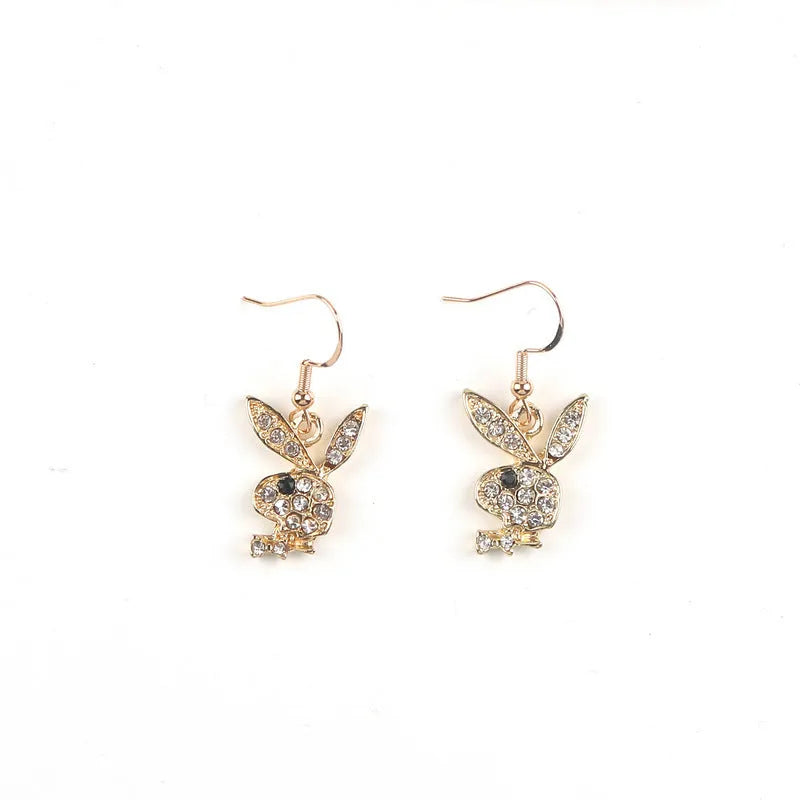 Pair of rabbit-shaped stud earrings with diamond accents on a silver background, showing front and back with butterfly clutch.