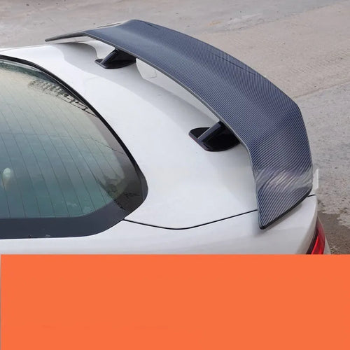 Universal punch-free car spoiler in ABS plastic showing blank, black, white, and carbon pattern finish options.