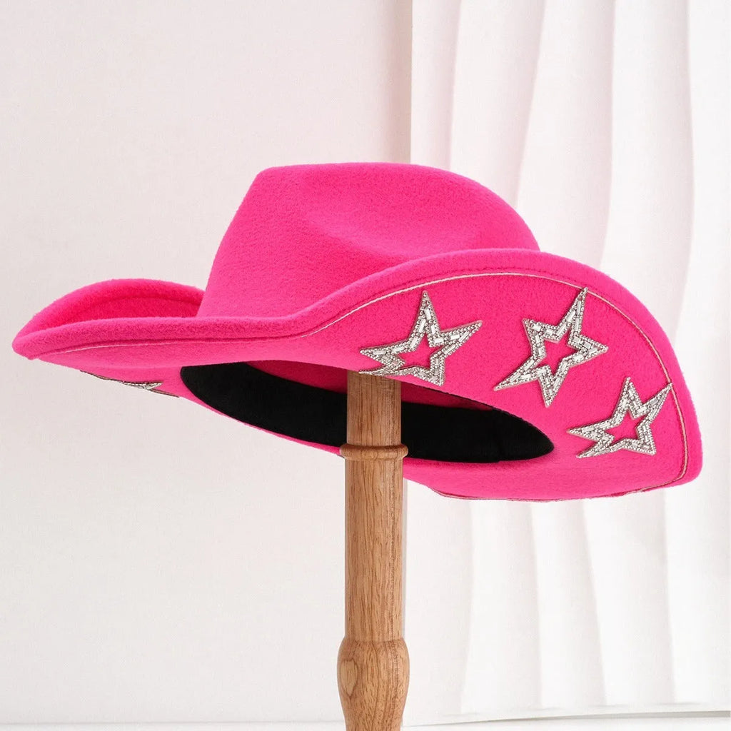 Beige woolen felt western style top hat with a conical crown and a silver hexagonal star decoration on the front.