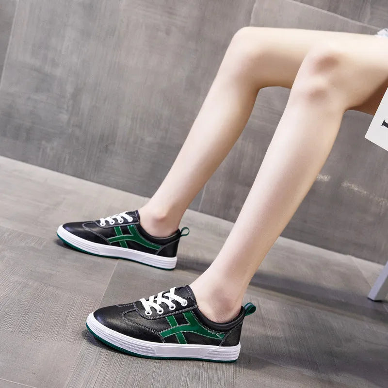 Women's black and white cowhide leather sneakers with elastic band fastening and rubber soles