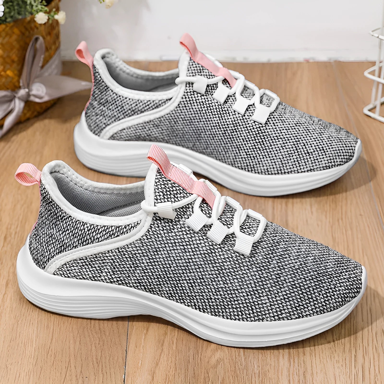 Women's casual flyknit mesh sneakers in black colour with round toe and low-top design
