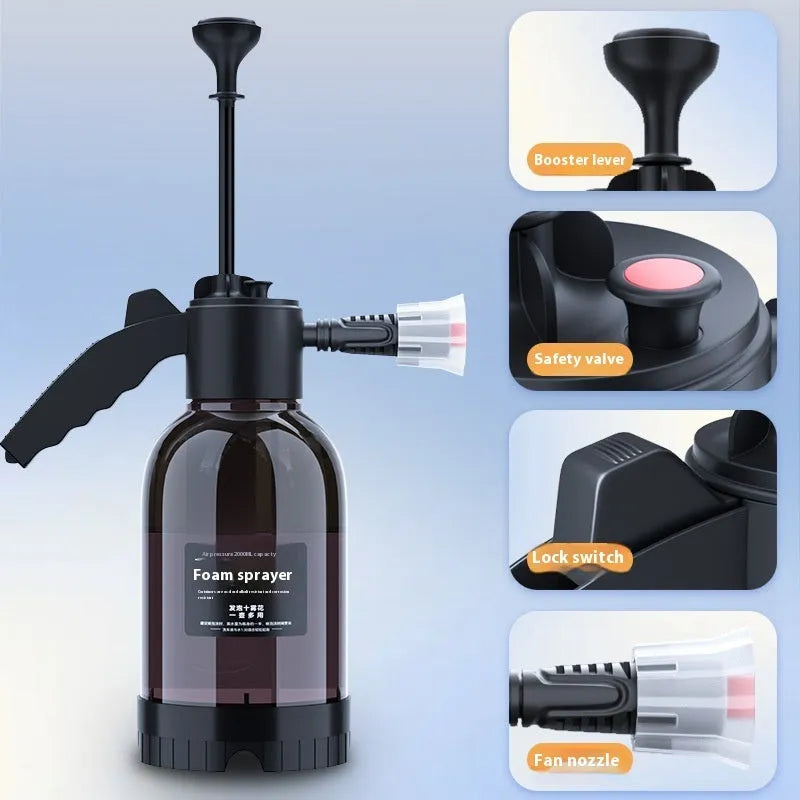 Black handheld 2L foam watering can sprayer with two nozzles and a comfort-grip handle.