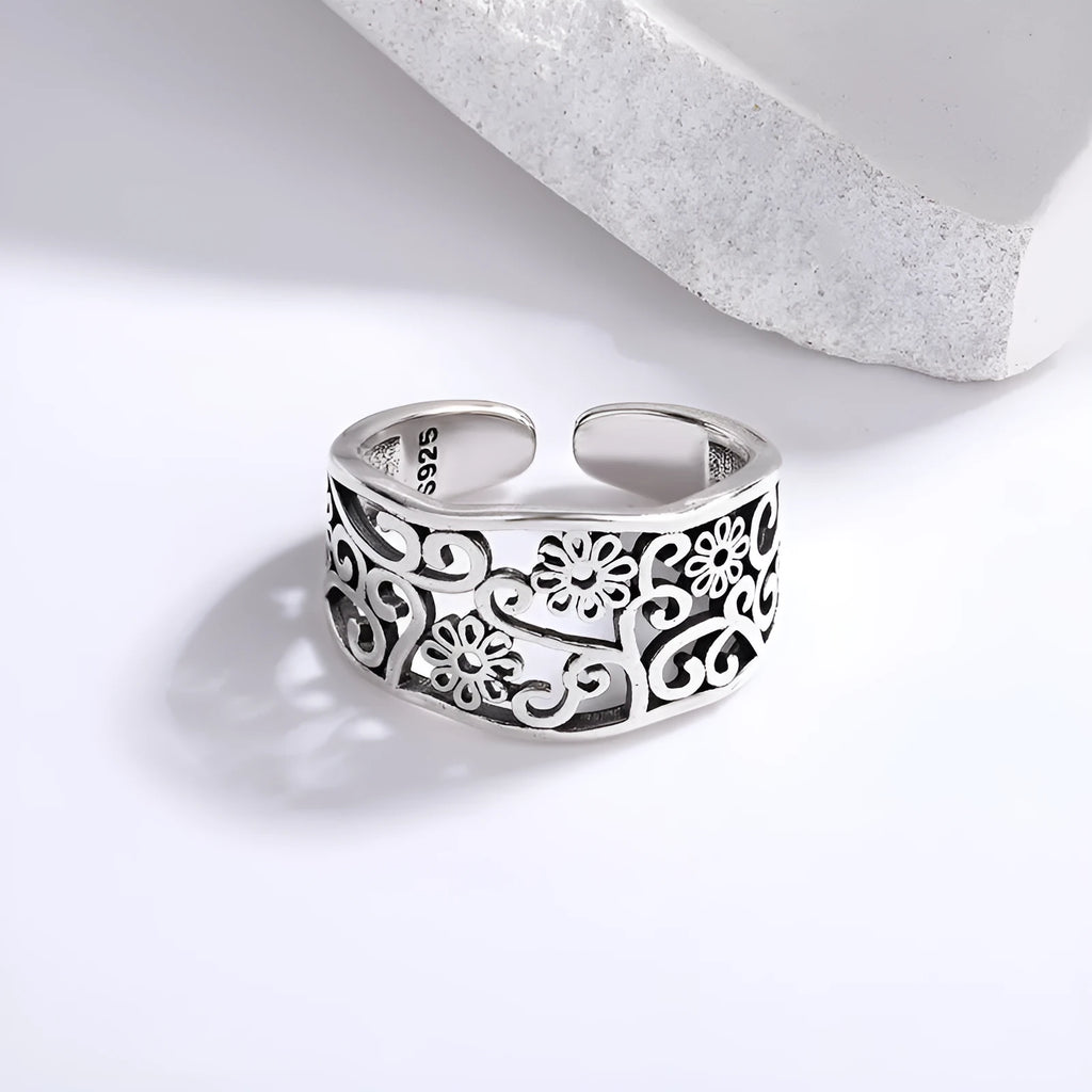 Silver plated open ring with hollow flower design, adjustable opening, retro style, colour retro JZ02137