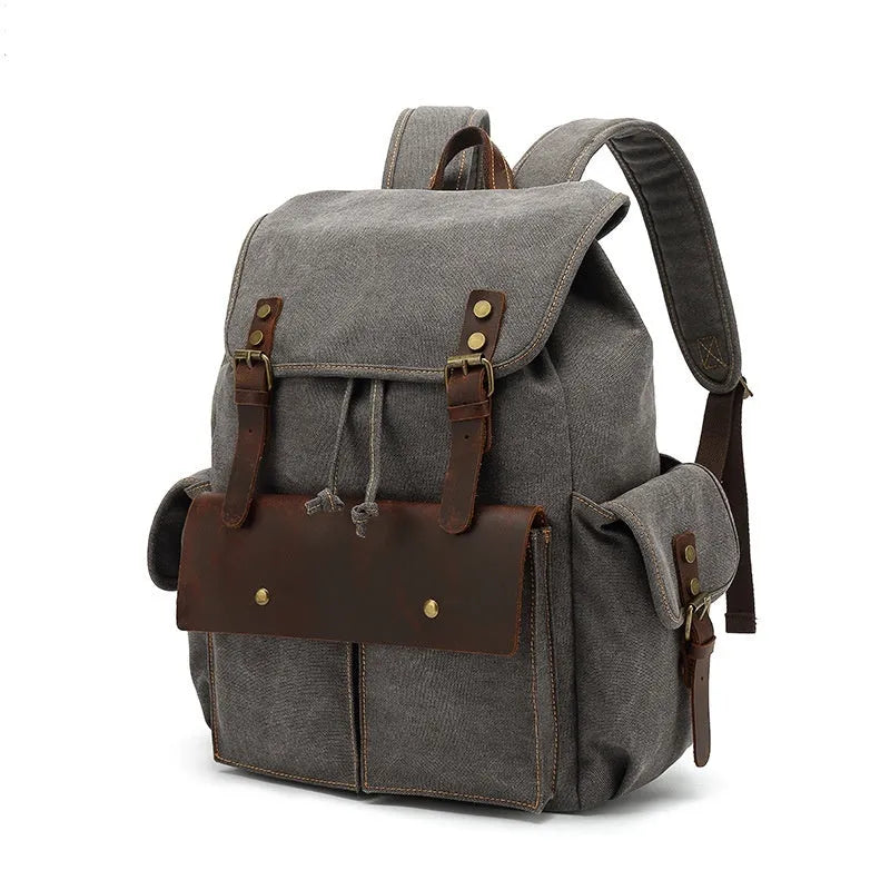 Retro canvas backpack in military green with antique bronze hardware showing front compartment organisation